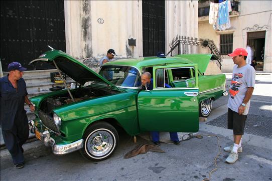 This is how they keep the cars lookin so good! 5 men to one car!