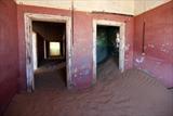 Sand dune invading colonial house