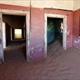 Sand dune invading colonial house