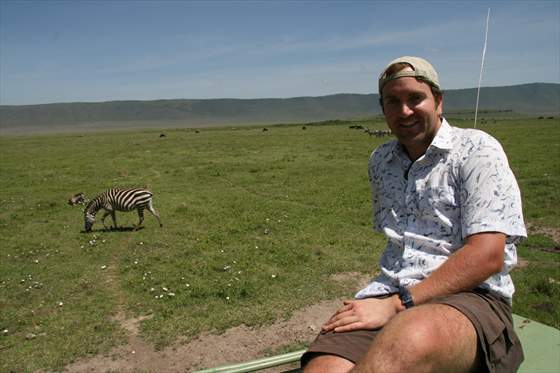 Sitting on roof of safari jeep