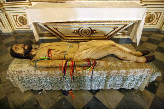 Ribbons on statue of Jesus