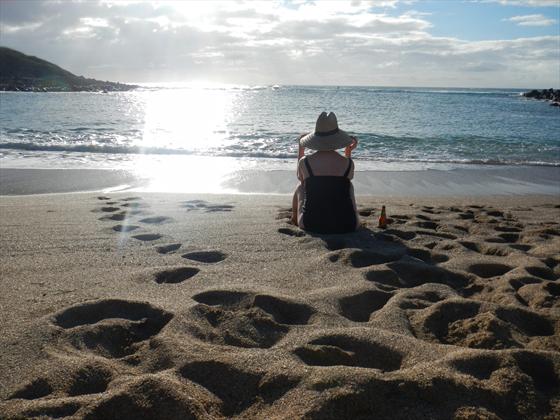 Joanne taking in the beauty of the beach