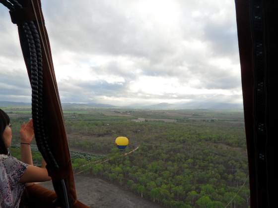 Flying above the other balloon