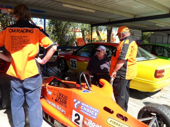 Charlie and the crew back at the garage