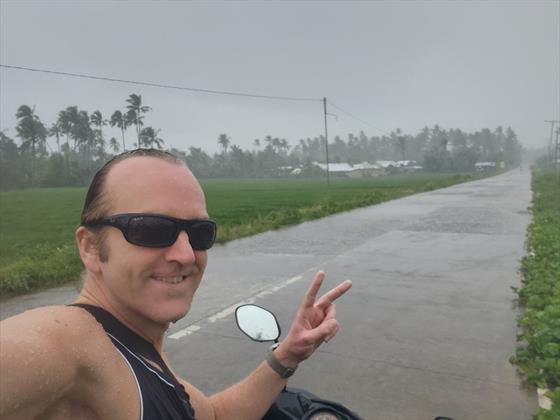 Getting saturated in tropical rain on scooter
